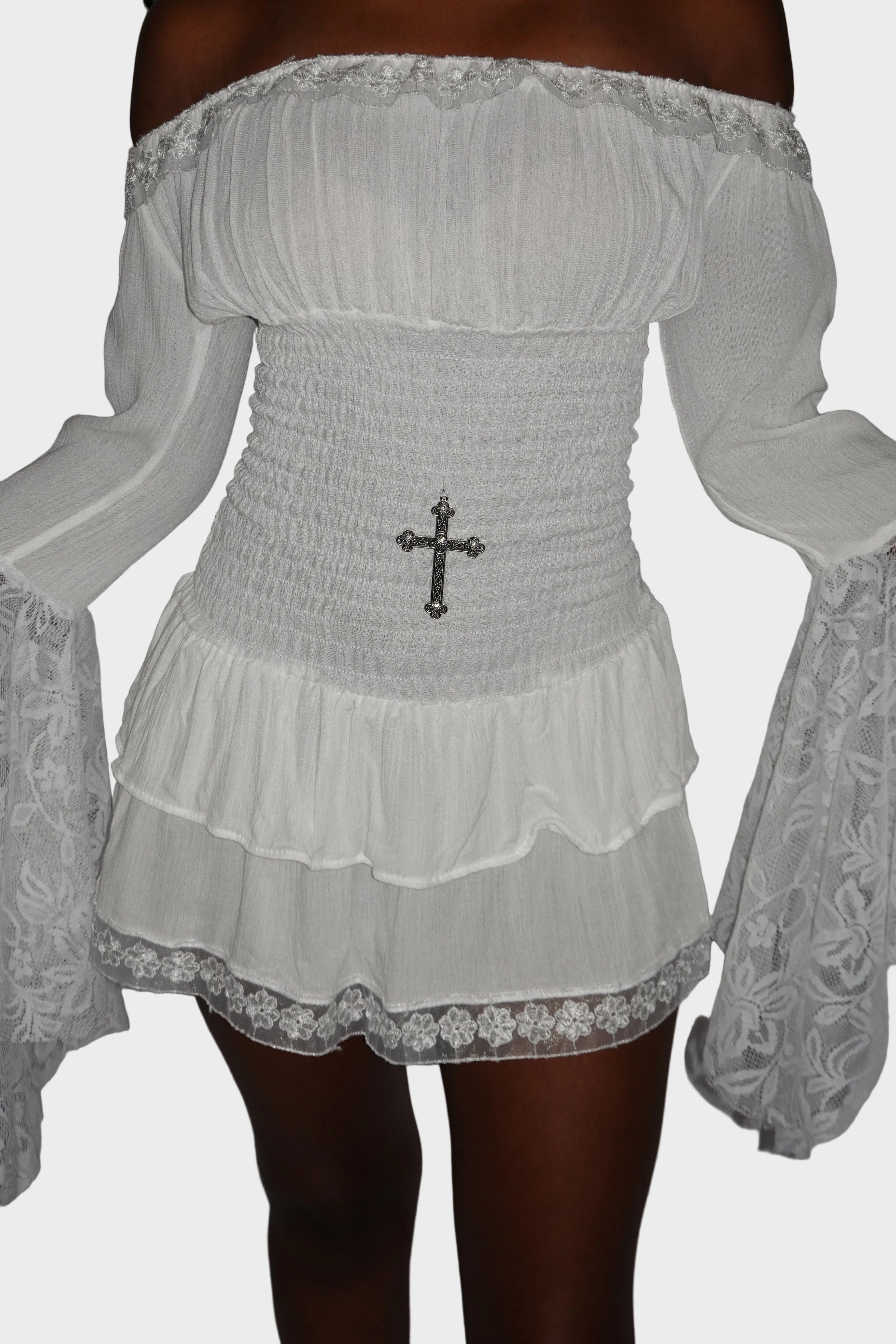 Detail shot of white mini dress with shirred drop waist and stainless steel cross charm. On model - Milkmaid mini dress (Ivory) - FM2U Clothing Australia | Gothic Alternative Whimsical Ethical Fashion