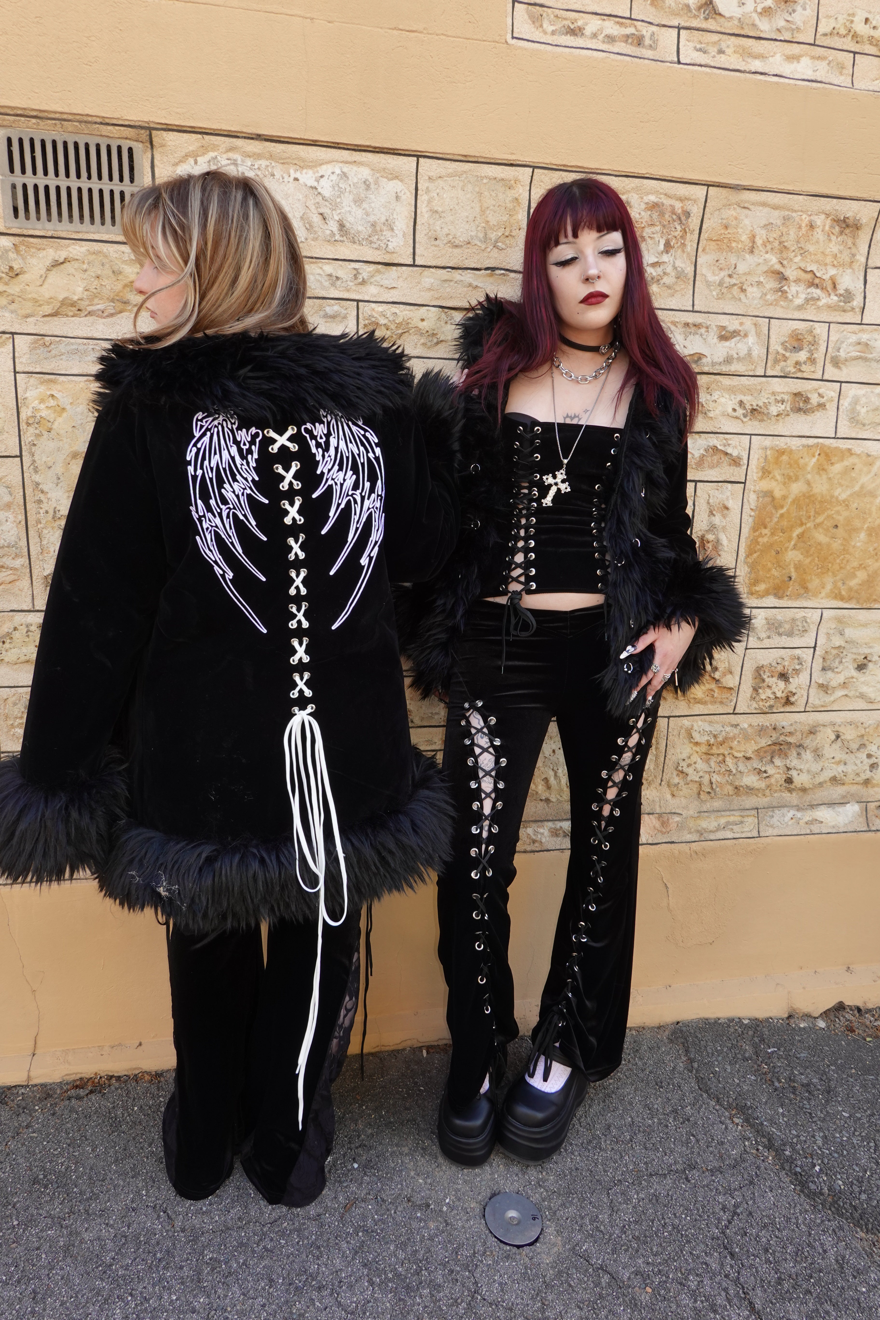 Group shot of Raven's embrace on left and Cascadia set on right. On left, showcasing embroidered white angel wings with cross-stitch design running down the spine - FM2U Clothing Australia | Gothic Alternative Whimsical Ethical Fashion
