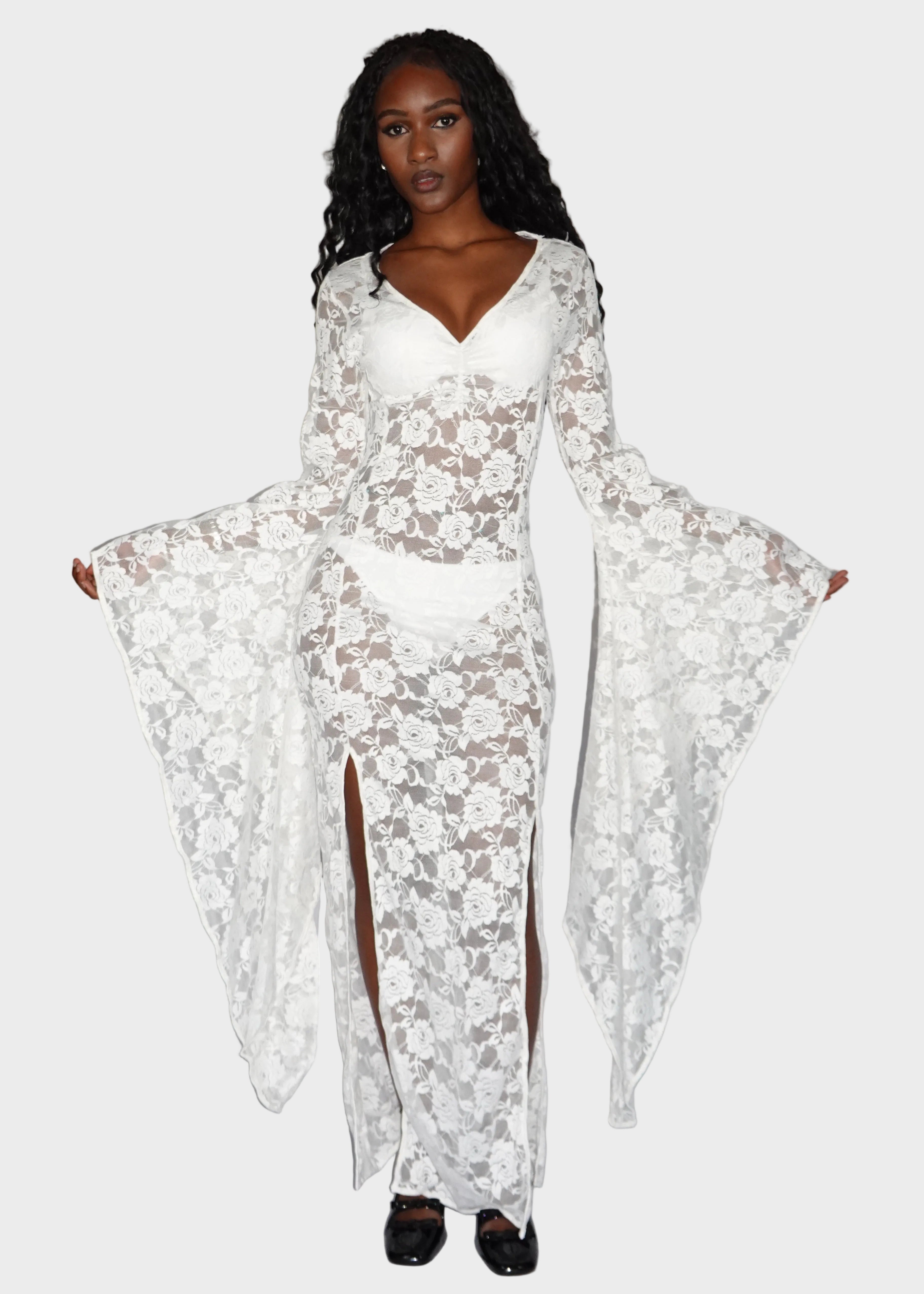 Full-body shot of white, rose-patterned, lace maxi dress made from polyester worn with white undergarments. On model - Cascadia (Ivory) - FM2U Clothing Australia | Gothic Alternative Whimsical Ethical Fashion