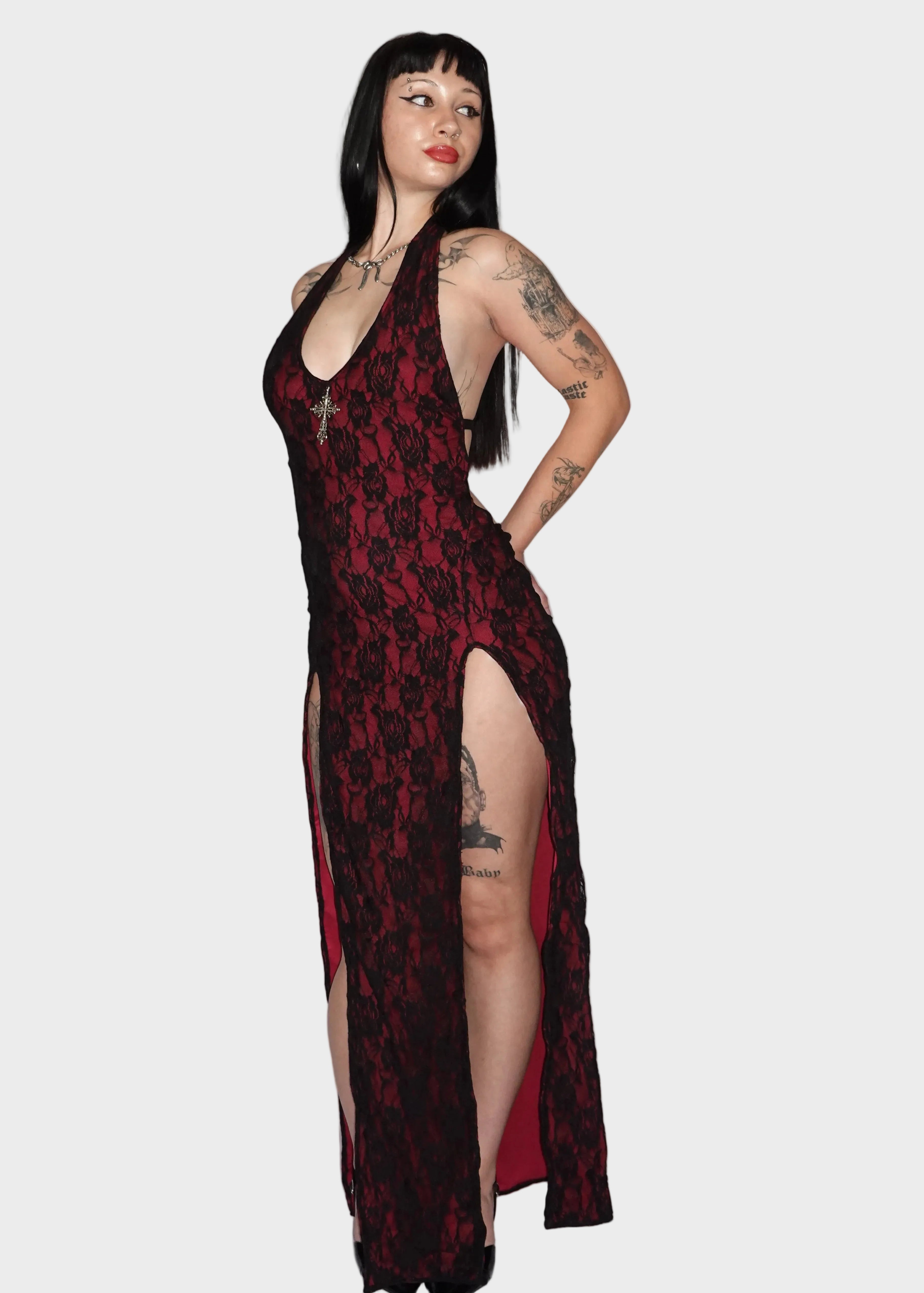 Side-view of dark red maxi dress with black floral lace overlay with dual leg slits. On model - Elvira Vampiress - FM2U Clothing Australia | Gothic Alternative Whimsical Ethical Fashion
