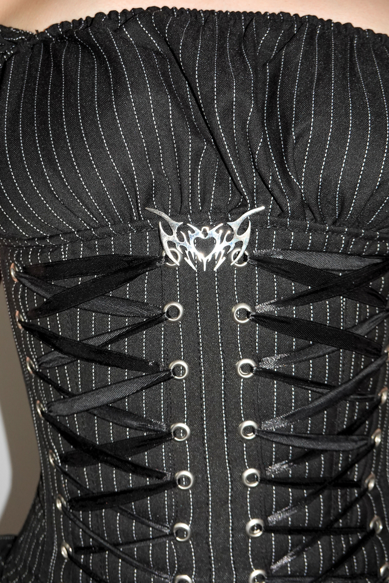 Close Up Detailing of FM2U Logo Charm and Ribbon Cinch!