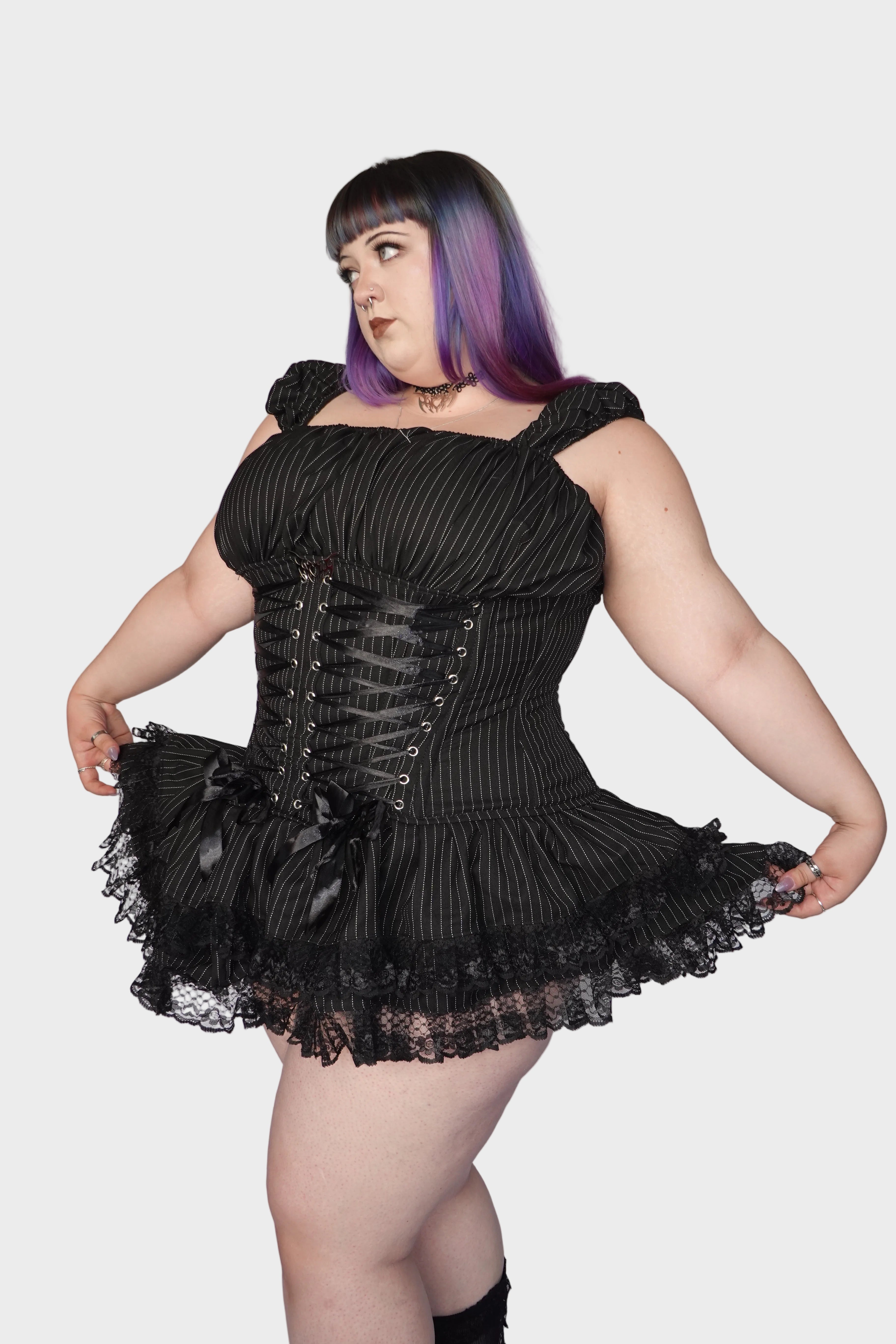 Front view of black pinstripe steel-boned corset mini dress with two tier ruffled lace skirt on model - Sirena Mini Dress - FM2U Clothing Australia | Gothic Alternative Whimsical Ethical Fashion