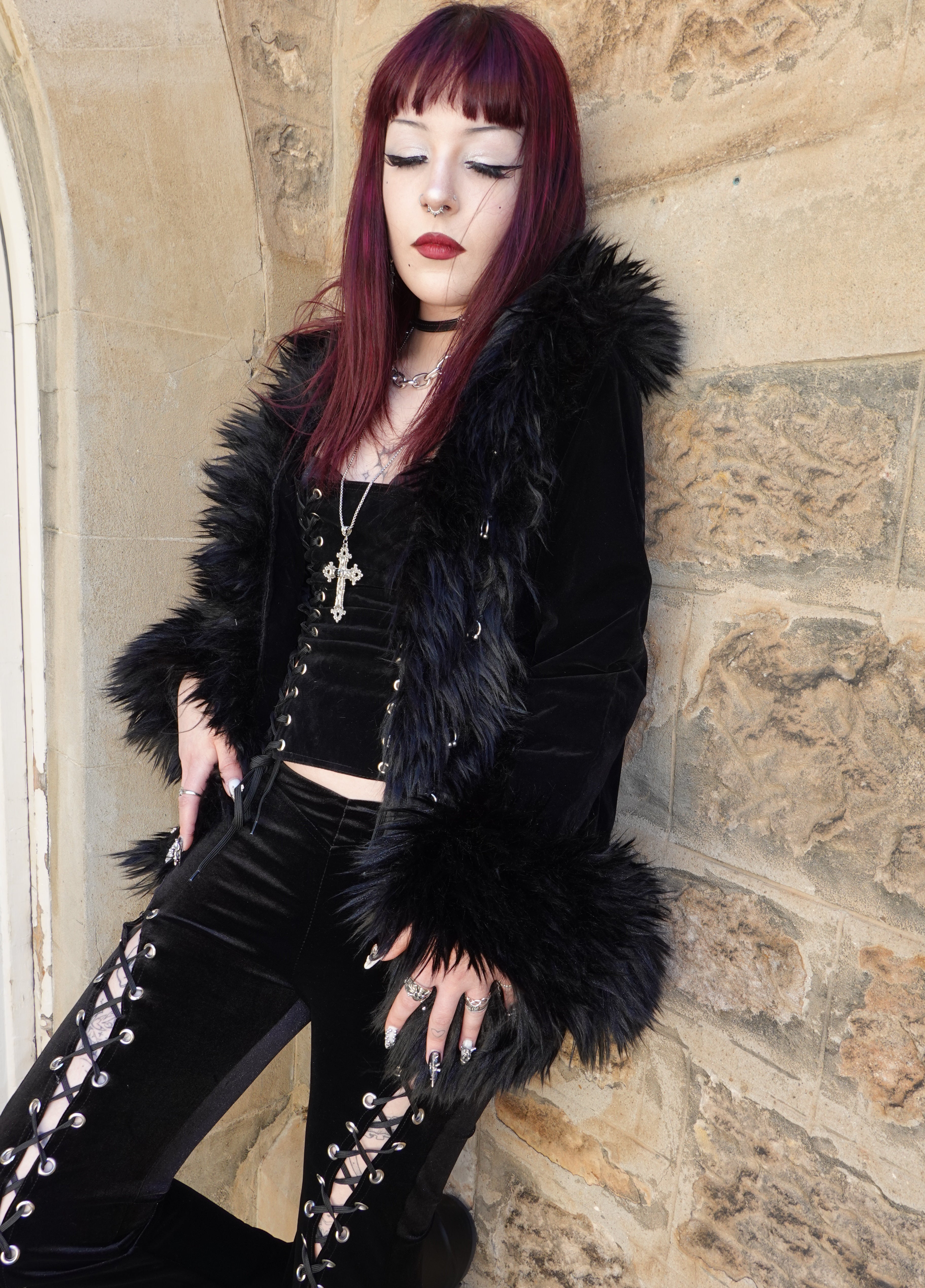 front side shot of curtain shot pierced afghan coat styled with dolly dress on church wall,  on model size XS - vampire vintage style 90s FM2U Clothing Australia | Gothic Alternative Whimsical Ethical Fashion 