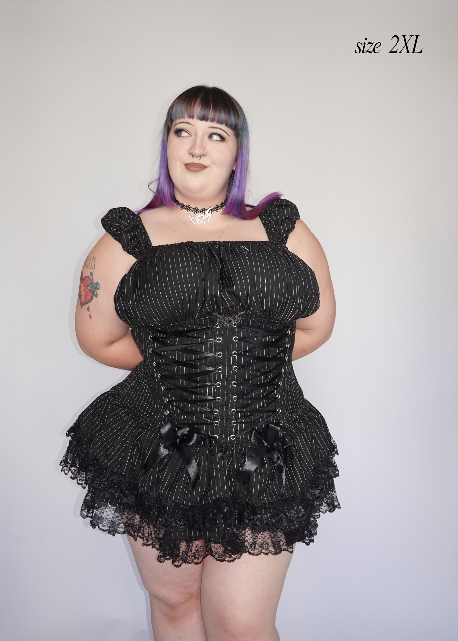 2XL model wearing black pinstripe steel-boned gothic corset mini dress with two tier ruffled lace skirt showing fit and silhouette - Sirena Mini Dress - FM2U Clothing Australia | Gothic Alternative Whimsical Ethical Fashion